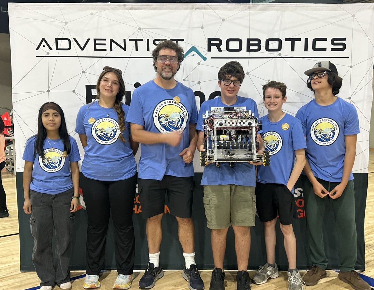 32314 Marcus Bartholomew the Third Senior team photo with robot at the League Championship